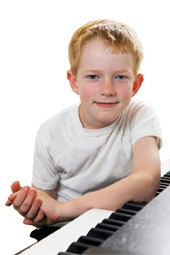 young-boy-learning-piano-in-forte-music-lesson